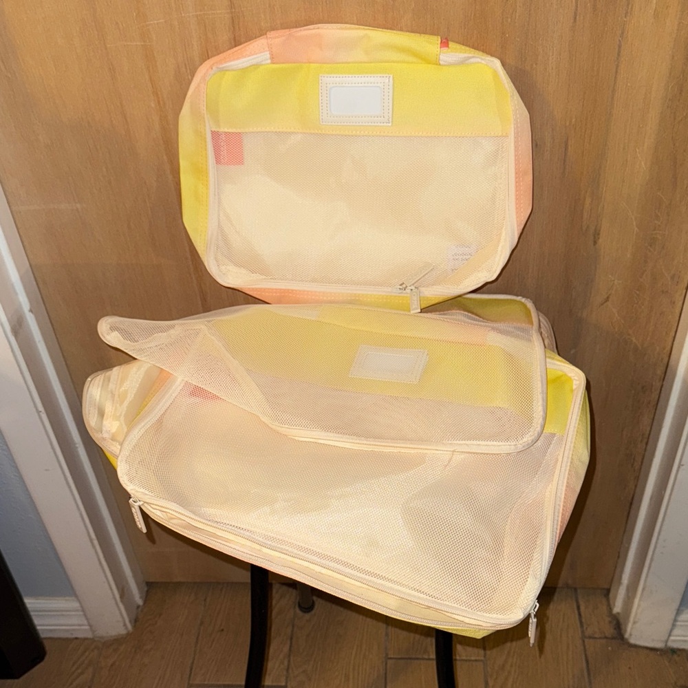NWOT Calpak 3 Pack of Yellow and Cream Travel Organizer Set
